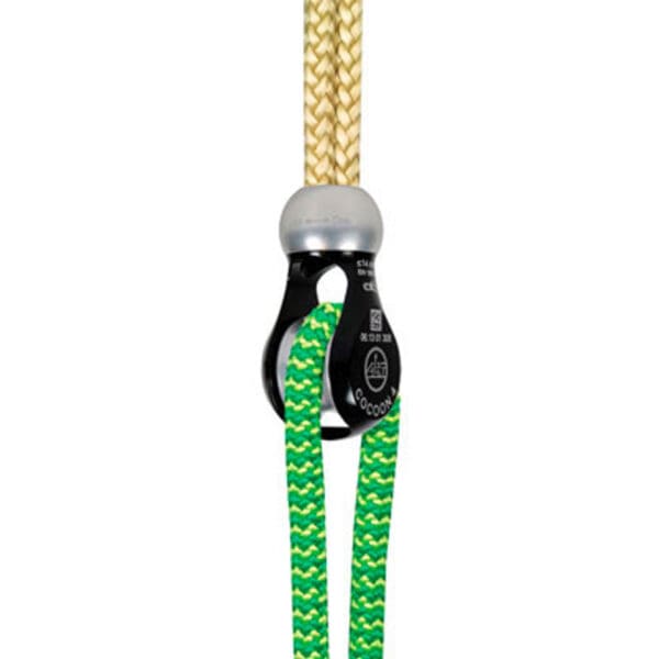 Black pulley with green rope and yellow rope.