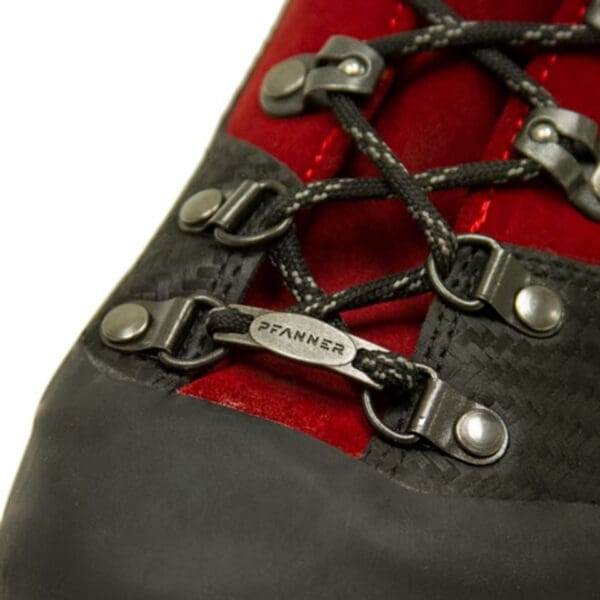 Closeup of red and black hiking boot.