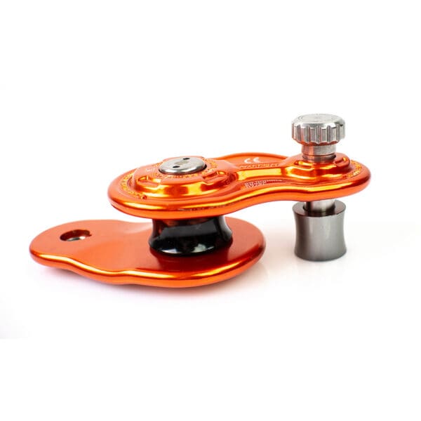 Orange climbing pulley with black wheel.