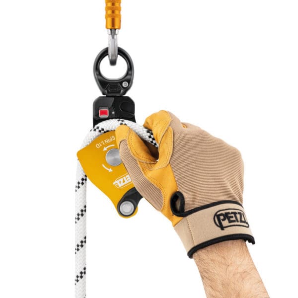 Hand using Petzl Spin LTD rope pulley.