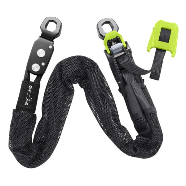 Black safety harness with green buckle.