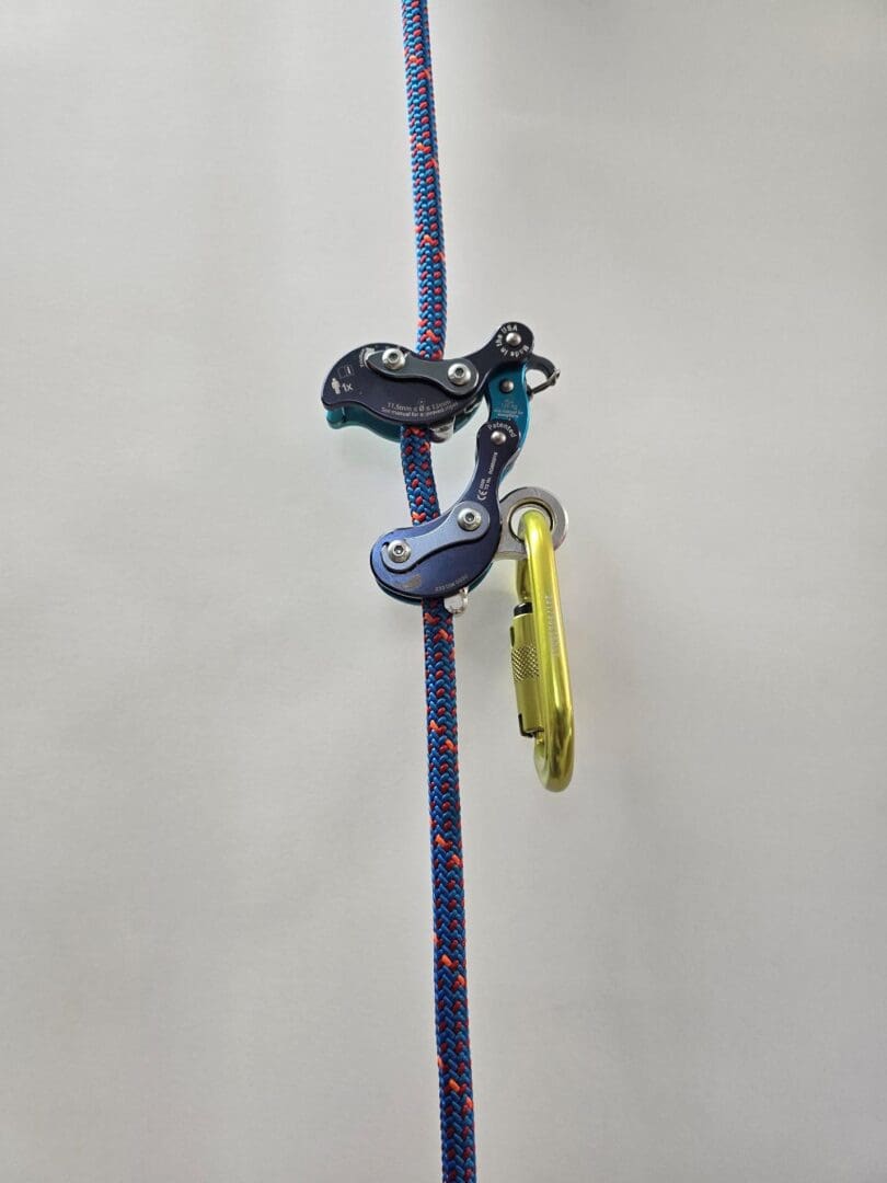 Climbing rope with ascender and carabiner.