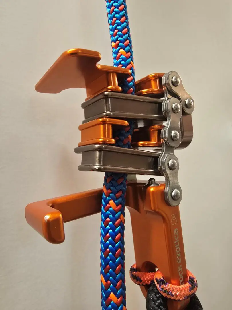 Orange climbing rope ascender with chain.