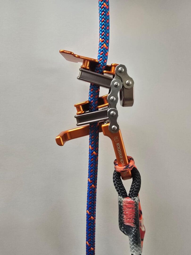 Orange rope climbing safety device.